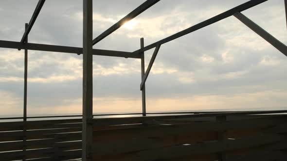 View of Rescue Tower on Seashore with Sunset