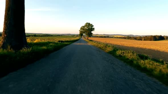 Car driving in spring time in rural countryside