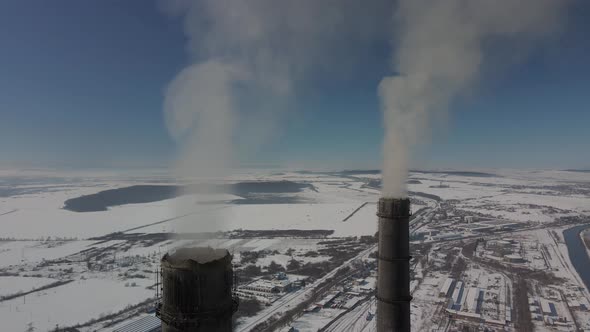 Thermal Power Plant  Smoking Chimneys Various Flights of Red and White Chimney in Winter Frosty Day