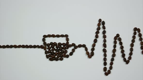 A Cardiogram With a Cup of Coffee Made of Coffee Beans