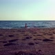 Aerial Drone Footage of a Girl Walking Along a Lonely Beach - VideoHive Item for Sale