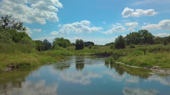 Summer River with Trees and Bushes. Aerial Landscape with Summer Scenery.