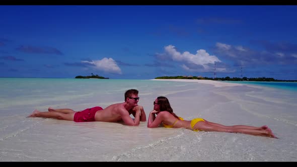 Romantic couple happy together on beautiful resort beach journey by blue sea and white sand backgrou