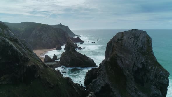 Aerial View of Rock Cliffs and Lighthouse