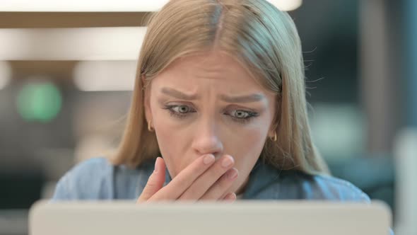 Close Up of Woman Reacting to Loss While Using Laptop