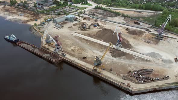 Large Harbor Cranes on the Shore at the Pier