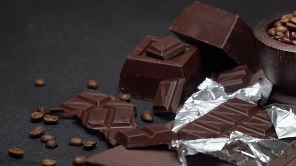 Dark Organic Chocolate and Coffee Beans on Concrete Background