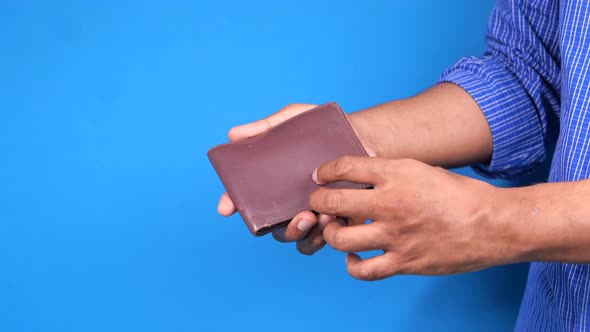 Man Hand Open an Empty Wallet with Copy Space