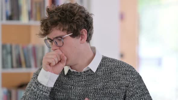 Portrait of Sick Young Man Coughing