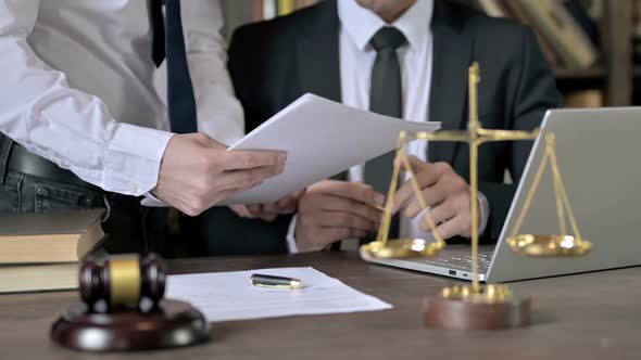 Close Up Shoot of Judge Hand Signing the Documents in Court Room