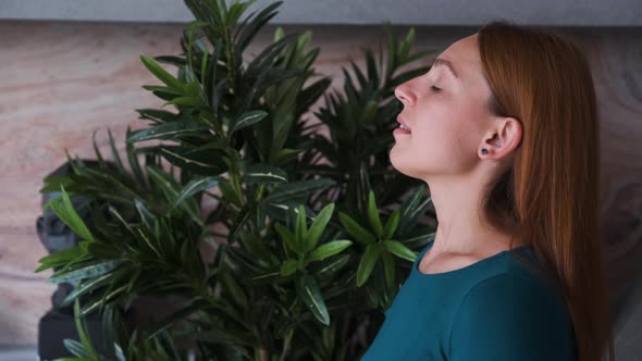 Young Woman Inhaling and Exhaling Fresh Air, Taking Deep Breath.