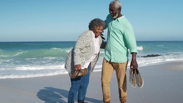 Senior couple standing together at the beach