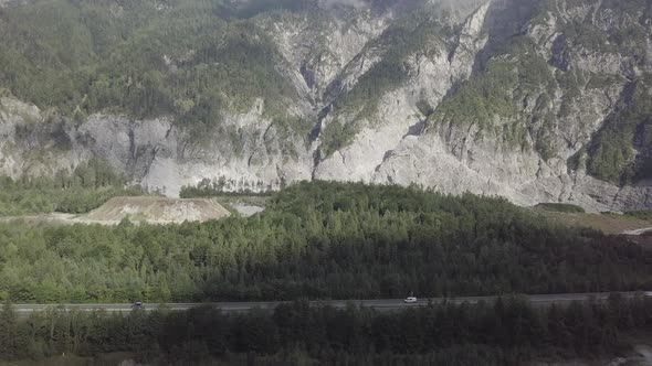 Aerial view of Alps mountains in summer, Tyrol Austria. Forest on hillside. Scenic nature cars drive