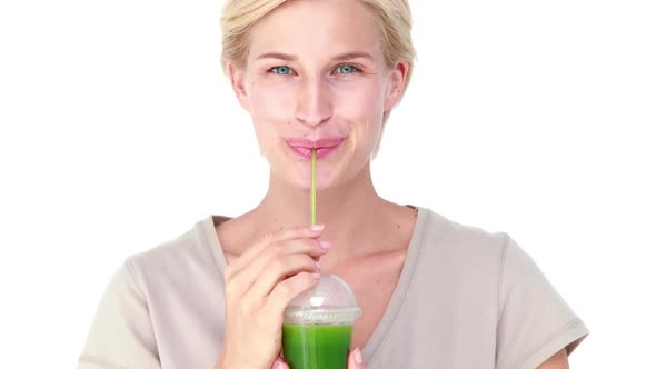 Pretty Blond Woman Drinking Vegetable Juice