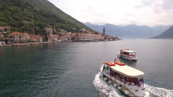 Ferry Sails Along Kotor Bay to the Coast of Perast Montenegro
