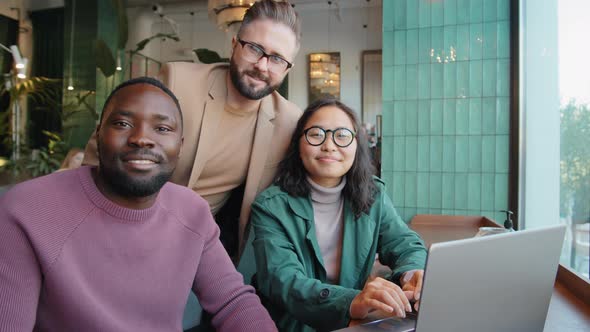 Portrait of Cheerful Multiethnic Business Team in Cafe