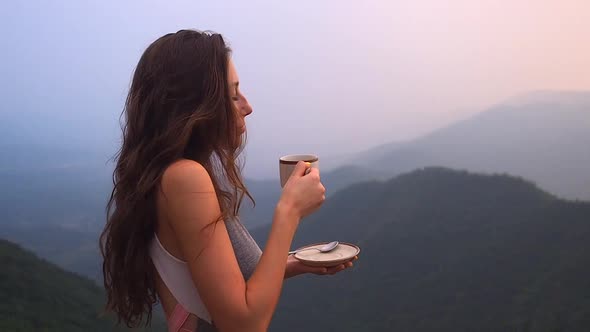 Beautiful Girl Enjoy the Organic Fresh Coffee or Masala Chai in India Hills with Top Nice View at