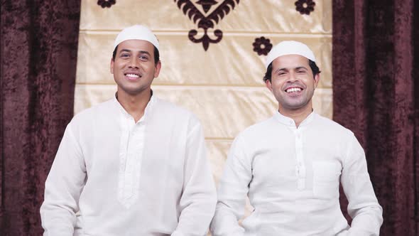 Muslim men smiling