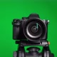 Professional DSLR Photo Camera with Lens at Green Background - VideoHive Item for Sale