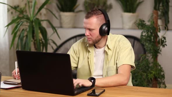 Man wearing headphones, study online education training, male student learning language