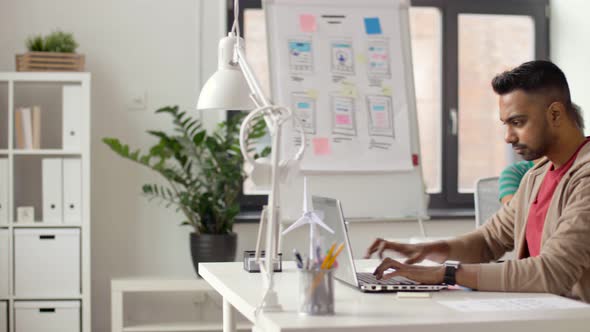 Indian Creative Man Working on Laptop at Office 6