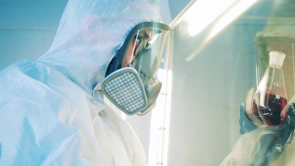 Laboratory Specialist is Observing Liquid in the Vacuum Cabinet