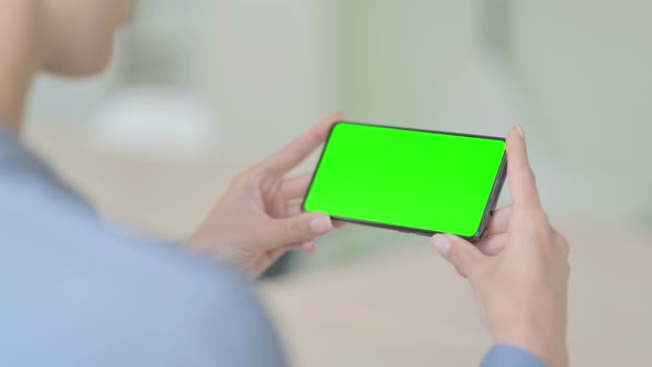 Woman Watching Smartphone with Chroma Screen