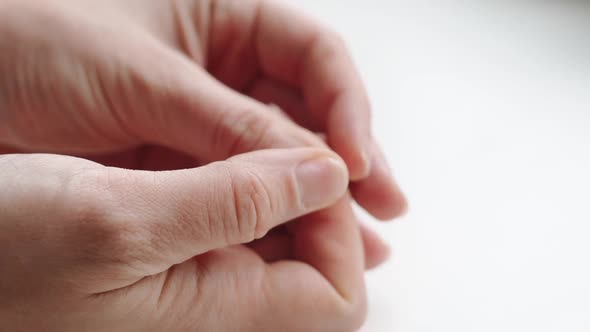 Close Up of Brittle Nails on Woman Hand