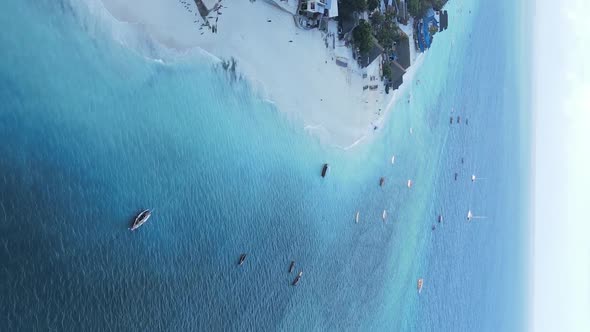 Vertical Video of the Ocean Near the Coast of Zanzibar Tanzania Aerial View