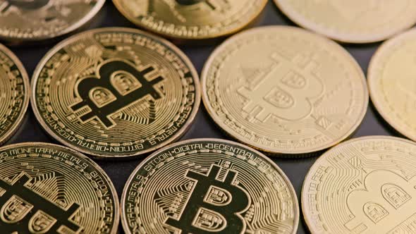 Bitcoin Coins on Black Background  Closeup Fullframe Spinning Background