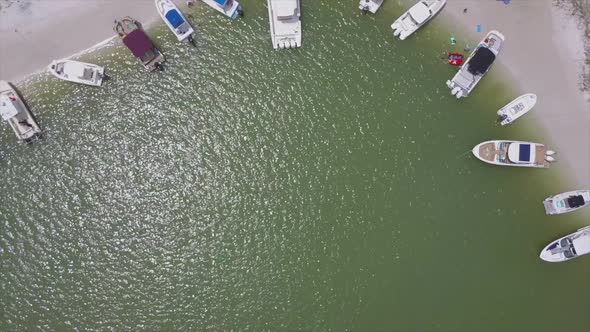 Drone shot of boats anchored on an island in Florida