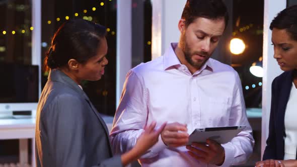 Businesspeople using digital tablet