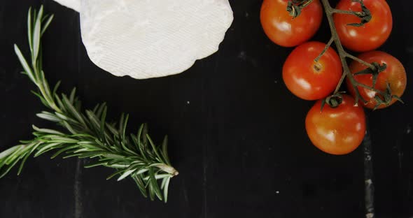 Cheese with tomatoes and rosemary herb