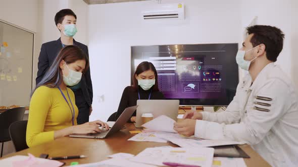 young asian woman and caucasian man Business people Working discuss finding new strategy solution