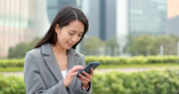 Woman use of cellphone for online at outdoor