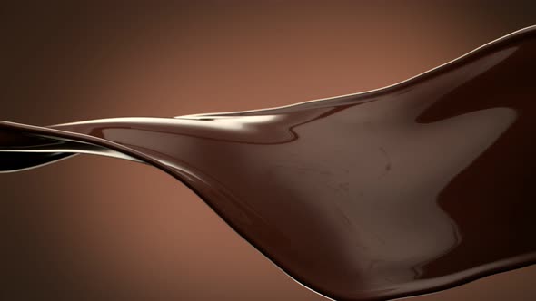 Super Slow Motion Shot of Twisting Chocolate Splash on Brown Gradient Background at 1000 Fps