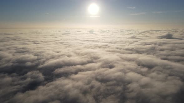 Aerial of the sunrise above the clouds