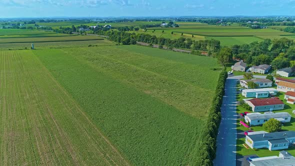 Rising Aerial View of Farmlands and Countryside on a Beautiful Summer Day