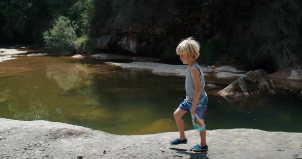 Children Walk to Swim in Mountain River Surrounded By Nature