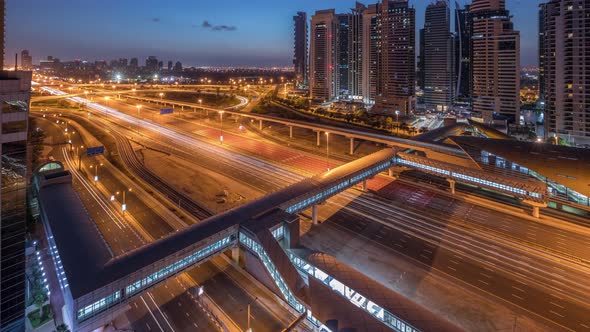 Aerial Top View to Sheikh Zayed Road Near Dubai Marina and JLT Night to Day Timelapse Dubai