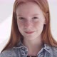 Funny Redhead Teenage Girl with Freckles Against White Wall with Sun Rays - VideoHive Item for Sale