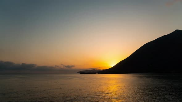 Time Lapse Sunrise over Sea and Mountain. Sunrise above Ocean. Beautiful Sun