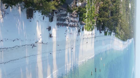 Vertical Video Boats in the Ocean Near the Coast of Zanzibar Tanzania Aerial View