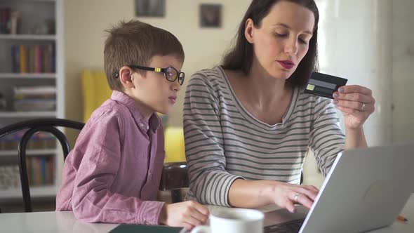 Mother and Lovely Kid Son Using Laptop at Home Spbd Smiling Mother Do Online Shopping