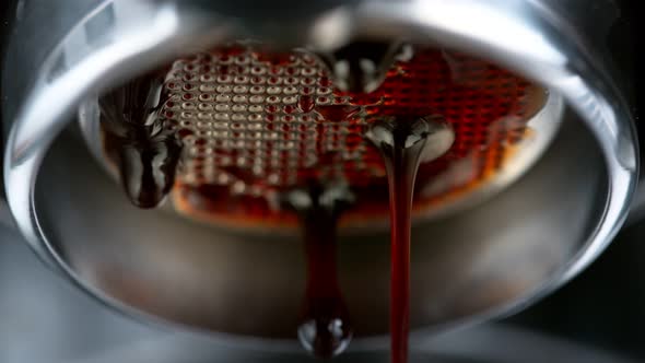 Super Slow Motion Macro Shot of Dripping Fresh Espresso Coffee From Lever Machine at 1000 Fps