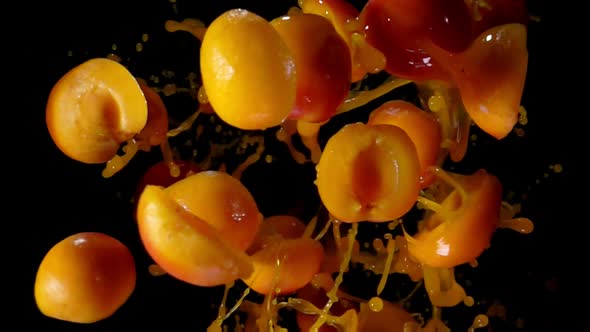 Apricots with Juice Bouncing Against To the Camera