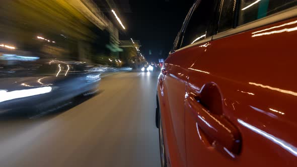 Drivelapse From Side of Car Moving on a Night Avenue in City Timelapse Hyperlapse