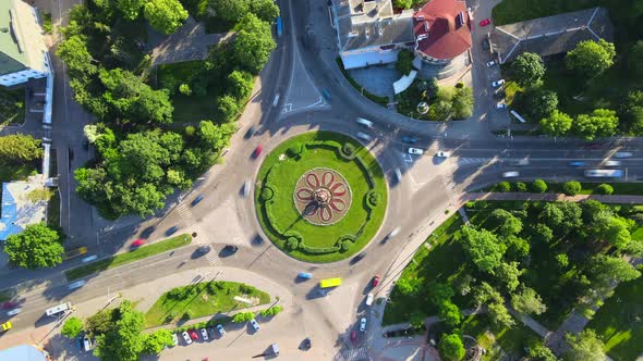  Aerial View Timelapse of Roundabout Road with Circular Cars in Small European City at Sunny Day