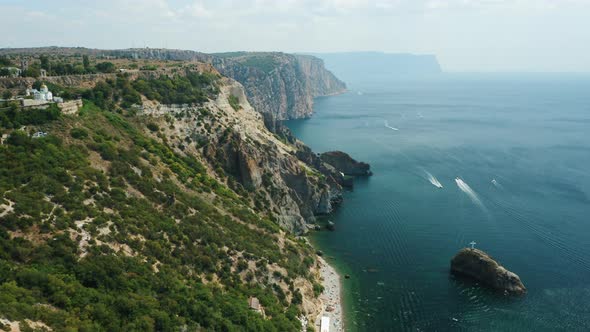 Aerial View of Calm Azure Sea and Volcanic Rocky Cliffs of Mys Fiolent