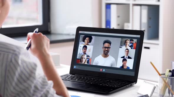 Woman with Laptop Having Video Call at Office